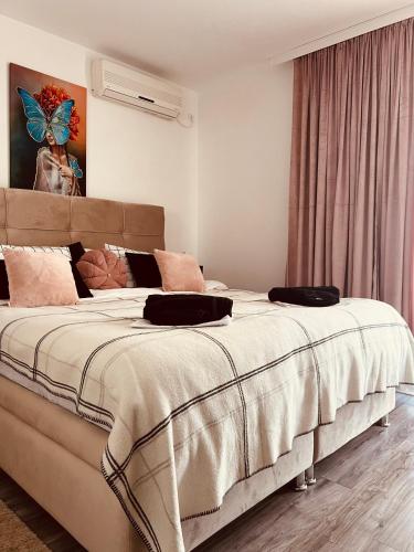 a bedroom with a large bed in a room at Vila Biva in Vrčin