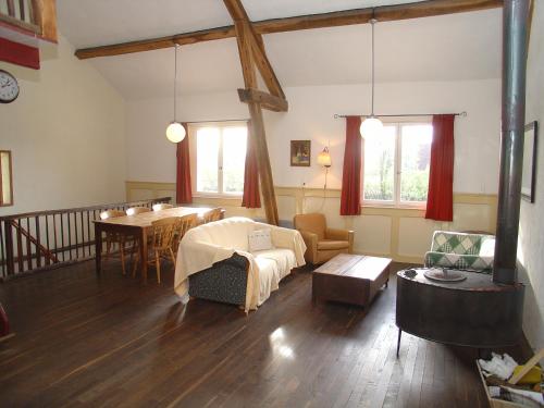 A bed or beds in a room at Domaine du Bourg Gites