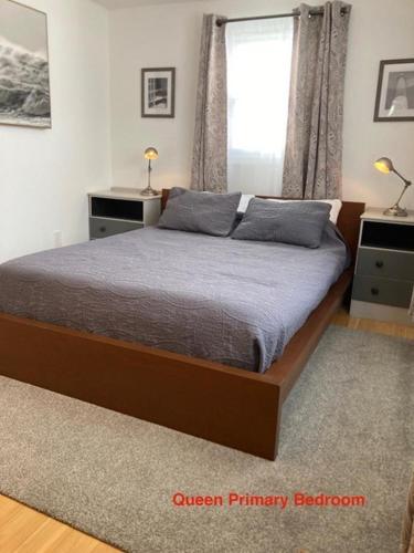 a bedroom with a bed and a window at Ocean Block Wifi Beach Badges Ship Bottom in Ship Bottom