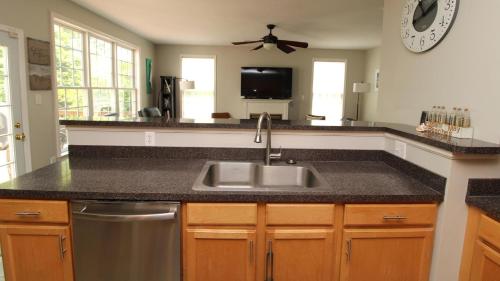 a kitchen with a sink and a counter top at The Happy Heron in West Cape May