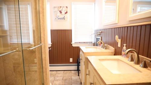 a bathroom with two sinks and a shower at 409 Princeton in Cape May Point