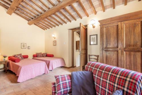 a living room with two beds and a couch at Casaletto ''La Lavanda'' in Bazzano Inferiore