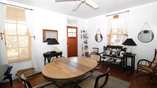 a living room with a wooden table and chairs at The Elmira Escape in Cape May