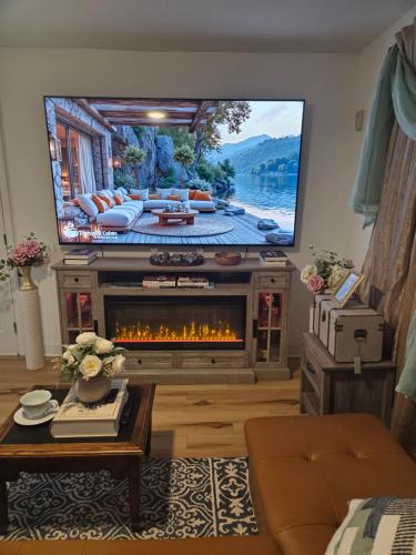 a living room with a tv and a fireplace at Brooklyn Luxury Suite in Brooklyn