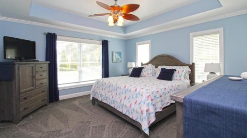a bedroom with a bed and a ceiling fan at 1036 Maryland Ave in Cape May
