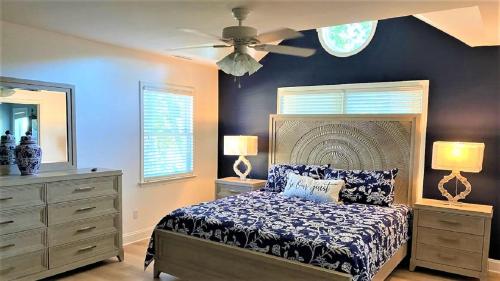 a bedroom with a bed and a ceiling fan at 717 Broadway in West Cape May
