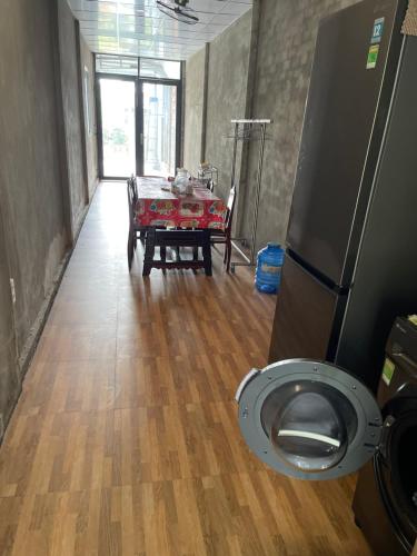 a room with a table and a toilet in it at Vùng ven Homestay in Cho Lach