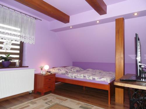 Una cama o camas en una habitación de Zielone Zacisze