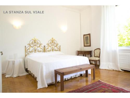 Un pat sau paturi într-o cameră la B&B Albaro