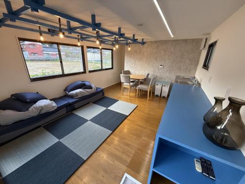 a living room with a couch and a table at Exsaison SETOUCHI in Sakaide
