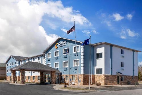 a hotel with an american flag on top of it at Comfort Inn & Suites in Wisconsin Dells