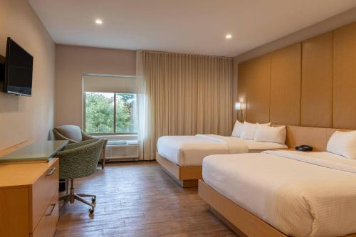Krevet ili kreveti u jedinici u okviru objekta The Chandler Inn Bethlehem - Littleton, an Ascend Collection Hotel