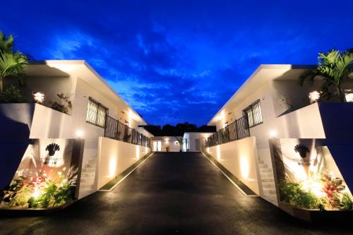 an empty hallway of a building at night at -Villa Rikyu- 離宮別館 in Miyako-jima