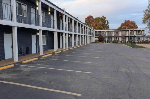 an empty parking lot in front of a building at Days Inn by Wyndham Champaign/Urbana in Champaign