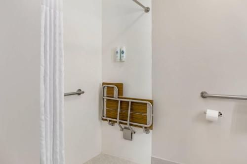 a bathroom with a shower with a shower curtain at Comfort Inn & Suites Springfield in Springfield