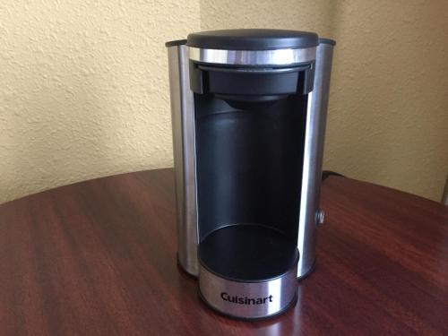 a coffee maker sitting on top of a table at Days Inn by Wyndham Airdrie in Airdrie