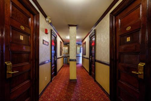 a hallway with a row of doors and a column at Hotel 31 Extended Stay in New York