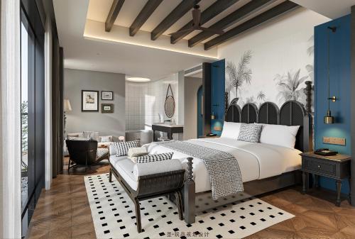 a bedroom with a bed and a living room at Glond Hotel in Luang Prabang