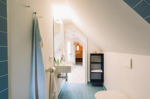 a bathroom with a sink and a toilet at Kapitänshaus Wieck in Wieck