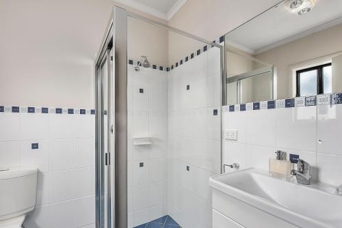 Et badeværelse på Mg Delux Apartment