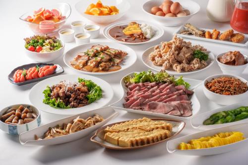 a table full of different types of food at Premier Hotel -CABIN- Obihiro in Obihiro