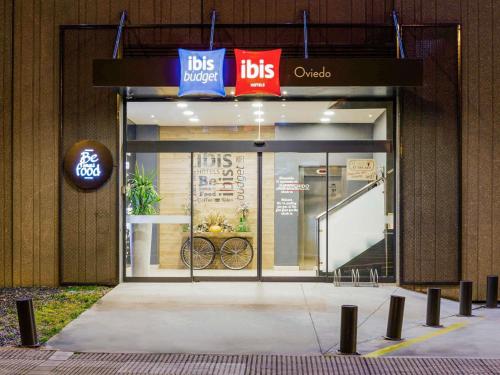 a front door of a ups store with a sign on it at Ibis Oviedo in Oviedo