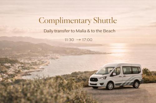 a white van parked on a hill next to the ocean at The Noverian Scenic Crete 5 Star Hilltop Villa Resort & Spa in Malia