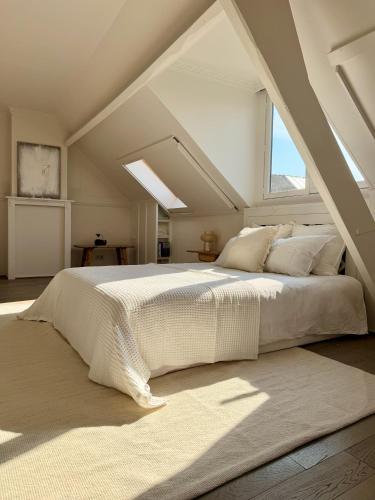 Llit o llits en una habitació de Maison d'Artiste