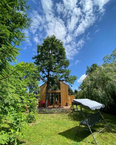 a house with a picnic table in the yard at Physio House Sokolik in Komarno