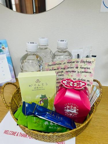 a basket filled with water bottles on a table at Maison du Skytree Tokyo in Tokyo