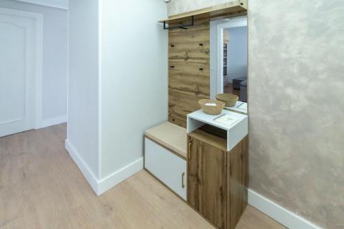 a bathroom with a sink and a mirror at Villa Si y No in Gijón