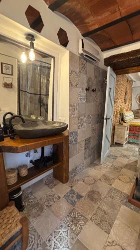 a bathroom with a sink in a room at La Maison de Magdala in Ronda