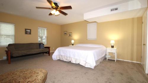 a bedroom with a bed and a ceiling fan at Relaxing Beginnings in Cape May Point