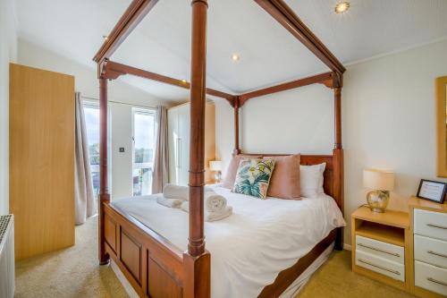 a bedroom with a four poster canopy bed at Field View 1 bed-No Pets-Cedar in Eye