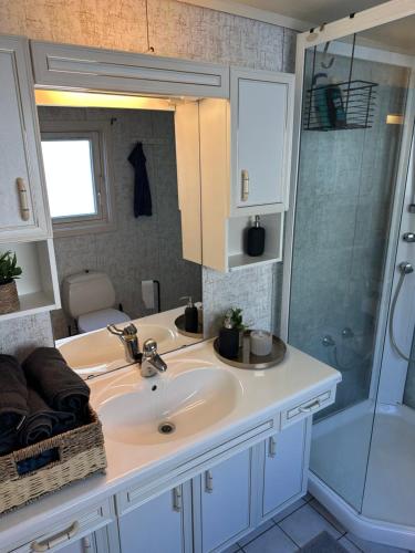 a bathroom with a sink and a shower at Gullvikvegen 33 in Namsos