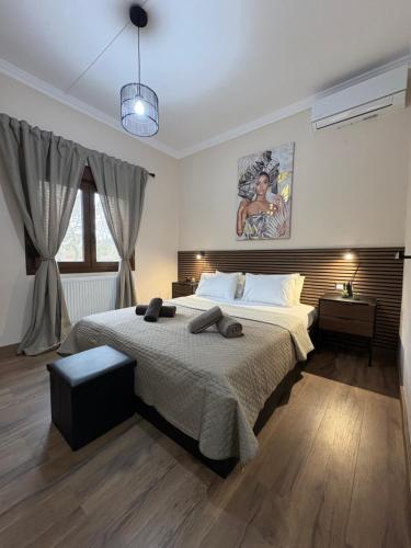 a bedroom with a large bed in a room at MP House Kassandrino Halkidiki in Kassandrinón