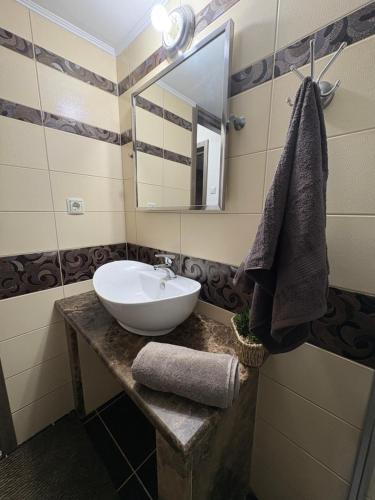 a bathroom with a sink and a mirror at MP House Kassandrino Halkidiki in Kassandrinón