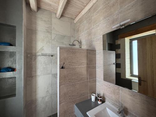 a bathroom with a sink and a mirror at MayaElisa Villa with Heated Pool, By Hellocrete in Vamos
