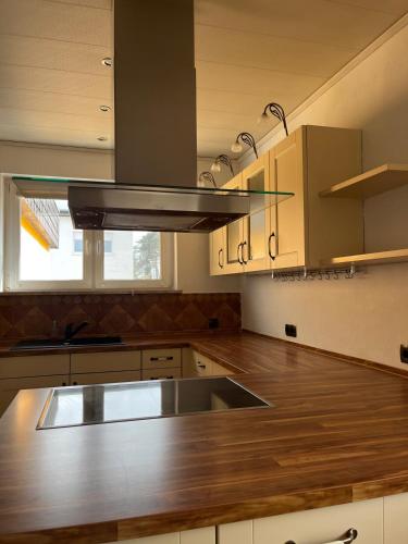 a kitchen with a sink and a stove top oven at Ferienwohnung Fatlume 2 in Bad Honnef am Rhein