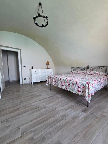 a bedroom with a bed and a dresser at Seaside Soul in Tropea