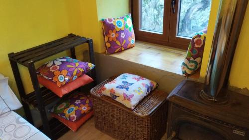 a room with pillows and a bed and a fireplace at refuxio de pambre in Palas de Rei
