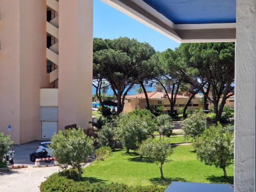 a view of a park from the balcony of a building at Varinos House Praia in Alvor
