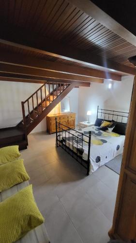 a bedroom with two bunk beds and a staircase at Vivienda Vacacional Miposa in Mocanal