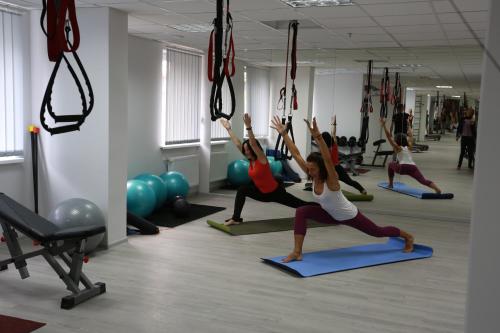 a group of people doing yoga in a gym at Lisova Pisnia Resort Hotel in Truskavets