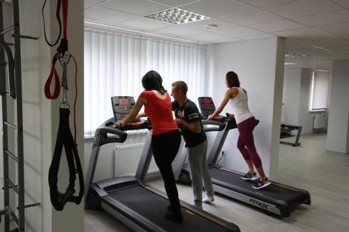 a group of people on treadmills in a gym at Lisova Pisnia Resort Hotel in Truskavets