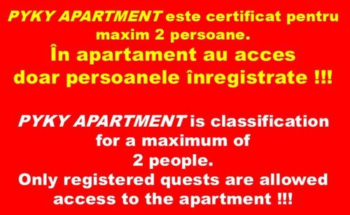 a red sign with the wordsasy apparatus assistcriticism maximum personnel in at Pyky Apartment in Baia Mare