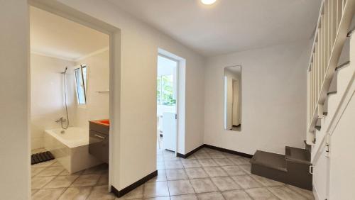 a white bathroom with a sink and a toilet at Casa Palmeiras, Seixal , Madeira in Seixal