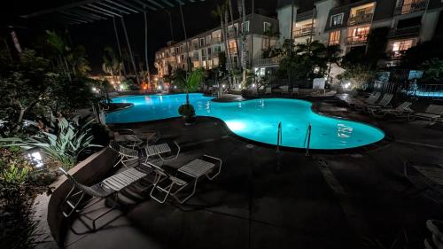 a swimming pool in a hotel at night at Oceanside Cozy Fun and Resortsy Getaway in Oceanside