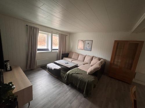 a living room with a couch and a table at 2 beds apartment centrally located in Gravdal in Gravdal