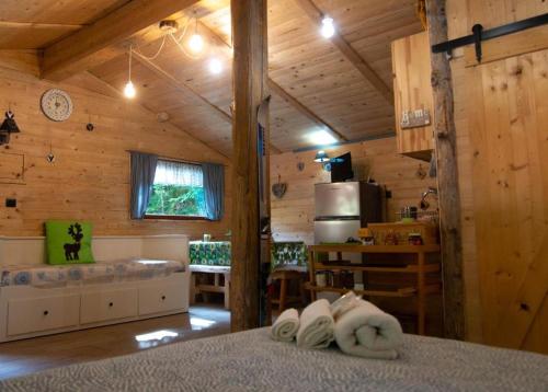 a room with wooden walls and a kitchen with towels at Il Borgo Don Camillo in Pian di Novello